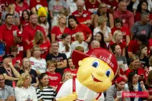 Nebraska Cornhusker mascot Lil' Red entertaining the fans against the Creighton Bluejays during the college volleyball match Tuesday, September 10, 2024, in Lincoln, Nebraska. Photo John S. Peterson.