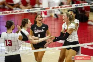 Nebraska Cornhusker setter Bergen Reilly (2) gives fives to middle blocker Andi Jackson (15) after a kill against the Creighton Bluejays in the second set during the college volleyball match Tuesday, September 10, 2024, in Lincoln, Nebraska. Photo John S. Peterson.