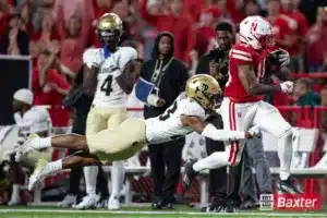 Nebraska Cornhusker running back Rahmir Johnson (14) runs with the ball against Colorado Buffalo safety Carter Stoutmire (23) in the fourth quarter during the college football game Saturday, September 7, 2024, in Lincoln, Nebraska. Photo John S. Peterson.