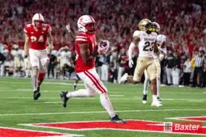 Nebraska Cornhusker running back Rahmir Johnson (14) scores a touchdown against the Colorado Buffaloes in the second quareter during the college football game Saturday, September 7, 2024, in Lincoln, Nebraska. Photo John S. Peterson.