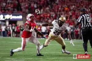 Nebraska Cornhusker running back Rahmir Johnson (14) maes a catch from a tipped ball by Colorado Buffalo linebacker LaVonta Bentley (20) in the second quarter during the college football game Saturday, September 7, 2024, in Lincoln, Nebraska. Photo John S. Peterson.