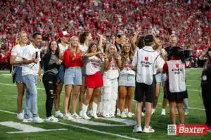 Nebraska Cornhusker volleyball team celebrates their Big Ten Championship during the college football game Saturday, September 7, 2024, in Lincoln, Nebraska. Photo John S. Peterson.