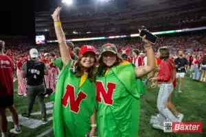 Nebraska Cornhusker student fans storm the field after the win against the Colorado Buffaloes after the college football game Saturday, September 7, 2024, in Lincoln, Nebraska. Photo John S. Peterson.