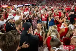 Nebraska Cornhusker student fans storm the field after the win against the Colorado Buffaloes after the college football game Saturday, September 7, 2024, in Lincoln, Nebraska. Photo John S. Peterson.