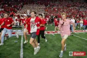 Nebraska Cornhusker student fans storm the field after the win against the Colorado Buffaloes after the college football game Saturday, September 7, 2024, in Lincoln, Nebraska. Photo John S. Peterson.