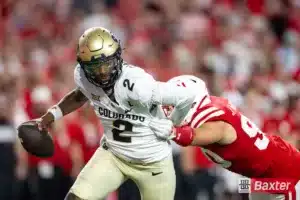 Nebraska Cornhusker defensive lineman James Williams (90) reaches out to tackle Colorado Buffalo quarterback Shedeur Sanders (2) in the second quarter during the college football game Saturday, September 7, 2024, in Lincoln, Nebraska. Photo John S. Peterson.
