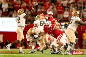 Nebraska Cornhuskers defensive lineman Nash Hutmacher (0) rushes Colorado Buffaloes quarterback Shedeur Sanders (2) during a game against the Colorado Buffaloes Saturday, September 7th 2024 at Memorial Stadium in Lincoln, Nebraska. Nebraska Photo by Eric Francis