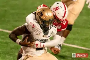 Nebraska Cornhuskers Nebraska Cornhuskers linebacker Princewill Umanmielen (18) wraps up Colorado Buffaloes quarterback Shedeur Sanders (2) during a game against the Colorado Buffaloes Saturday, September 7th 2024 at Memorial Stadium in Lincoln, Nebraska. Nebraska Photo by Eric Francis.