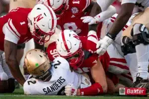 Nebraska Cornhuskers defensive lineman James Williams (90) and teammates sack Colorado Buffaloes quarterback Shedeur Sanders (2) during a game against the Colorado Buffaloes Saturday, September 7th 2024 at Memorial Stadium in Lincoln, Nebraska. Nebraska Photo by Eric Francis