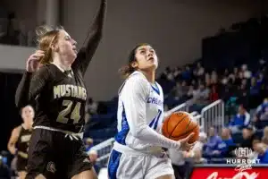 Creighton Bluejay guard Kiani Lockett (11) makes a lay up against Southwest Minnesota State Mustang guard Kadence Hesse (24) in the second half during a college women’s basketball game Thursday, October 30, 2024, in Lincoln, Nebraska. Photo by John S. Peterson.