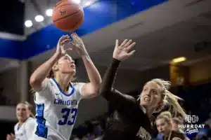 Creighton Bluejay guard/forward Brooke Littrell (33) and Southwest Minnesota State Mustang forward Audrey Swanson (22) go for the rebound in the first half during a college women’s basketball game Thursday, October 30, 2024, in Lincoln, Nebraska. Photo by John S. Peterson.