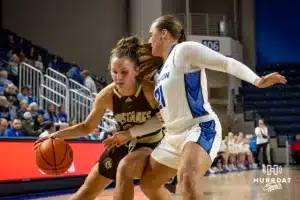 Creighton Bluejay guard Molly Mogensen (21) defends against Southwest Minnesota State Mustang guard Peyton Blandin (21) in the first half during a college women’s basketball game Thursday, October 30, 2024, in Lincoln, Nebraska. Photo by John S. Peterson.