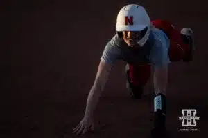Nebraska Cornhusker Jordyn Bahl (98) dives back to first base during the Red White softball game Wednesday, October 23, 2024, in Lincoln, Nebraska. Photo by John S. Peterson.