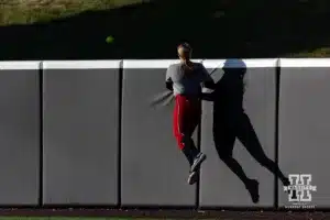 Nebraska Cornhuskers Abbie Squier jumps up watching the ball go over the wall for a home run during the Red White softball game Wednesday, October 23, 2024, in Lincoln, Nebraska. Photo by John S. Peterson.