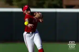 Nebraska Cornhusker Lauren Camenzind (2) throws to first base during the Red White softball game Wednesday, October 23, 2024, in Lincoln, Nebraska. Photo by John S. Peterson.