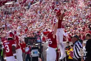 Indiana Hoosier wide receiver Elijah Sarratt (13) celebrates a touchdown with Indiana Hoosier offensive lineman Trey Wedig (75) against the Nebraska Cornhuskers during a football game Saturday, October 19, 2024, in Bloomington, Indiana. Photo by John S. Peterson.