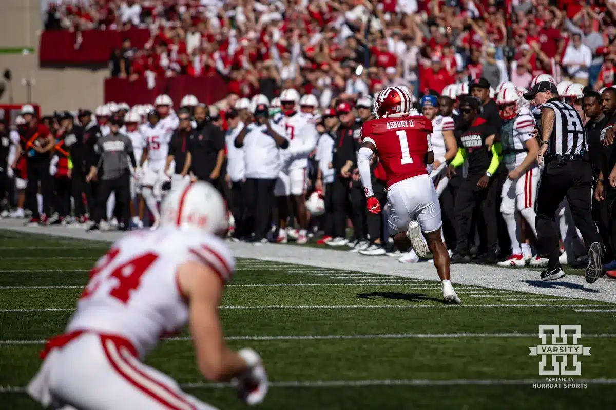 Indiana Hoosier defensive back Shawn Asbury II (1) runs with the ball after making an interception against Nebraska Cornhusker tight end Thomas Fidone II (24) during a football game Saturday, October 19, 2024, in Bloomington, Indiana. Photo by John S. Peterson.