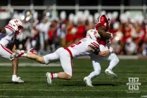 Nebraska Cornhusker defensive back Isaac Gifford (2) tackles Indiana Hoosier wide receiver Myles Price (4) during a football game Saturday, October 19, 2024, in Bloomington, Indiana. Photo by John S. Peterson.