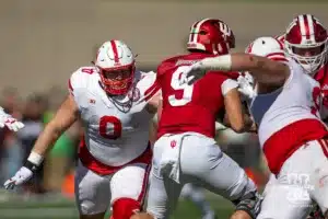 Nebraska Cornhusker defensive lineman Nash Hutmacher (0) and Ty Robinson go after Indiana Hoosier quarterback Kurtis Rourke (9) during a football game Saturday, October 19, 2024, in Bloomington, Indiana. Photo by John S. Peterson.