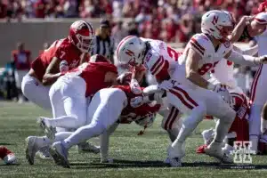 Nebraska Cornhusker running back Dante Dowdell (23) fumbles the ball from a hit by Indiana Hoosier linebacker Jailin Walker (2) during a football game Saturday, October 19, 2024, in Bloomington, Indiana. Photo by John S. Peterson.