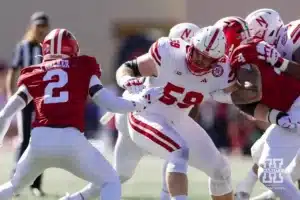 Nebraska Cornhusker offensive lineman Henry Lutovsky (59) blocking Indiana Hoosier linebacker Jailin Walker (2) and Aiden Fisher during a football game Saturday, October 19, 2024, in Bloomington, Indiana. Photo by John S. Peterson.
