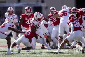 Nebraska Cornhusker running back Dante Dowdell (23) runs with the ball against Indiana Hoosier defensive back D'Angelo Ponds (5) during a football game Saturday, October 19, 2024, in Bloomington, Indiana. Photo by John S. Peterson.