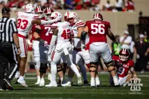Nebraska Cornhusker linebacker Mikai Gbayor (42) celebrates sacking Indiana Hoosier quarterback Kurtis Rourke (9) during a football game Saturday, October 19, 2024, in Bloomington, Indiana. Photo by John S. Peterson.