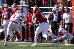 Nebraska Cornhusker defensive back Marques Buford Jr. (3) reaches for Indiana Hoosier running back Justice Ellison (6) as Vincent Shavers Jr. chases during a football game Saturday, October 19, 2024, in Bloomington, Indiana. Photo by John S. Peterson.