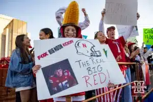 Nebraska Cornhusker fan hold a sign at the Fox Big Noon Kickoff show before a football game Saturday, October 19, 2024, in Bloomington, Indiana. Photo by John S. Peterson.