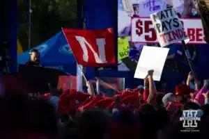 Nebraska Cornhuskers fans wave a Nebraska flag at the Fox Big Noon Kickoff before a football game Saturday, October 19, 2024, in Bloomington, Indiana. Photo by John S. Peterson.