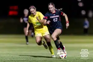 Nebraska Cornhusker forward Sarah Weber (42) on the attack against Oregon Duck defender Ainsley Fink (20) in the second half during a soccer match Thursday, October 17, 2024, in Lincoln, Nebraska. Photo by John S. Peterson.