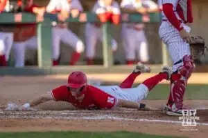 Nebraska's Jaron Cotton (13) slides home during a baseball scrimmage Tuesday, October 15, 2024, in Lincoln, Nebraska. Photo by John S. Peterson.