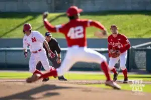 Nebraska's Case Sanderson (14) leads off as Nebraska's Jalen Worthley (42) throws a pitch in the second inning during a baseball scrimmage Tuesday, October 15, 2024, in Lincoln, Nebraska. Photo by John S. Peterson.