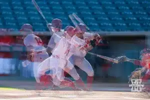 A multi-exposure photo of Nebraska's Case Sanderson (14) at bat getting a base hit in the second inning during a baseball scrimmage Tuesday, October 15, 2024, in Lincoln, Nebraska. Photo by John S. Peterson.