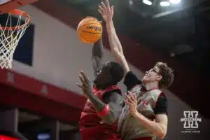 Nebraska Cornhusker Juwan Gary (red) grabs a rebound against Gavin Griffiths (gray) during a scrimmage Sunday, October 13, 2024, in Lincoln, Nebraska. Photo by John S. Peterson.