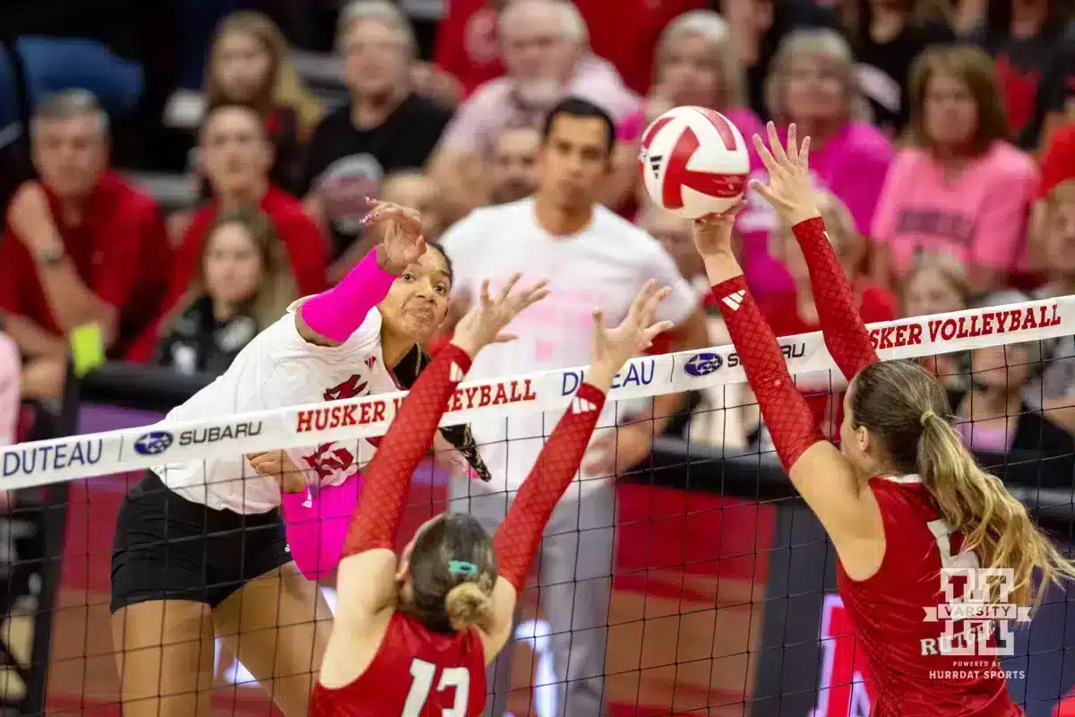 Nebraska Volleyball v Rutgers – October 12, 2024. Nebraska Cornhusker Taylor Landfair (12) spikes the ball against Rutgers Scarlet Knight setter Aly Borellis (5) during a college volleyball match Saturday, October 12, 2024, in Lincoln, Nebraska. Photo by John S. Peterson.