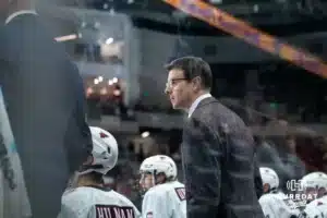 Omaha Maverick head coach Mike Gabinet watching the action on the ice against the Wisconsin Badgers in a college hockey match Saturday, October 5, 2024 in Omaha, Nebraska. Photo by Kyle Byers.