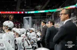 Omaha Maverick head coach Mike Gabinet watching the action on the ice against the Wisconsin Badgers in a college hockey match Saturday, October 5, 2024 in Omaha, Nebraska. Photo by Kyle Byers.