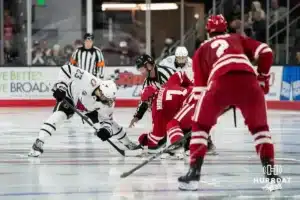 Omaha Maverick Harrison Israels (23) facing off against the Wisconsin Badgers in a college hockey match Saturday, October 5, 2024 in Omaha, Nebraska. Photo by Kyle Byers.