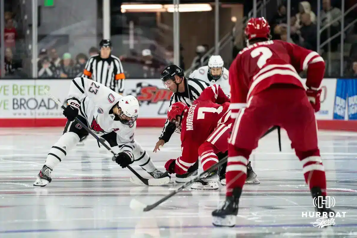 Omaha Maverick Harrison Israels (23) facing off against the Wisconsin Badgers in a college hockey match Saturday, October 5, 2024 in Omaha, Nebraska. Photo by Kyle Byers.