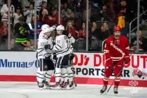 Omaha Maverick Nolan Krenzen (12) celebrates a goal against the Wisconsin Badgers in a college hockey match Saturday, October 5, 2024 in Omaha, Nebraska. Photo by Kyle Byers.