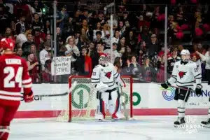 Omaha Maverick Simon Latkoczy (30) standing in front of the goal against the Wisconsin Badgers in a college hockey match Saturday, October 5, 2024 in Omaha, Nebraska. Photo by Kyle Byers.