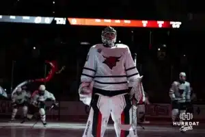 Omaha Maverick Simon Latkoczy (30) lines up during Omaha Hockey introductions before taking on the Wisconsin Badgers in a college hockey match Saturday, October 5, 2024 in Omaha, Nebraska. Photo by Kyle Byers.