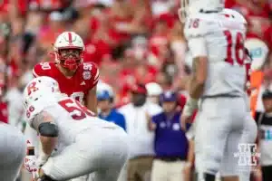 Nebraska Cornhusker defensive lineman James Williams (90) watches Rutgers Scarlet Knight quarterback Athan Kaliakmanis (16) during a college football game Saturday, October 5, 2024, in Lincoln, Nebraska. Photo by John S. Peterson.