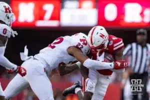 Nebraska Cornhusker wide receiver Jahmal Banks (4) is tackled by Rutgers Scarlet Knight linebacker Tyreem Powell (22) during a college football game Saturday, October 5, 2024, in Lincoln, Nebraska. Photo by John S. Peterson.