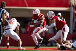 Nebraska Cornhusker running back Rahmir Johnson (14) runs with the ball against Rutgers Scarlet Knight defensive back Shaquan Loyal (6) during a college football game Saturday, October 5, 2024, in Lincoln, Nebraska. Photo by John S. Peterson.
