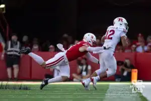 Nebraska Cornhusker linebacker John Bullock (5) tackles Rutgers Scarlet Knight tight end Kenny Fletcher (12) during a college football game Saturday, October 5, 2024, in Lincoln, Nebraska. Photo by John S. Peterson.