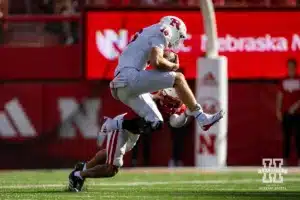 Nebraska Cornhusker defensive back Malcolm Hartzog Jr. (7) tackles Rutgers Scarlet Knight quarterback Athan Kaliakmanis (16) during a college football game Saturday, October 5, 2024, in Lincoln, Nebraska. Photo by John S. Peterson.