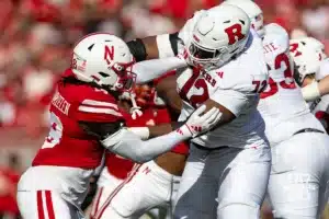 Nebraska Cornhusker linebacker Princewill Umanmielen (18) and Rutgers Scarlet Knight tight end Kenny Fletcher (12) battle during a college football game Saturday, October 5, 2024, in Lincoln, Nebraska. Photo by John S. Peterson.