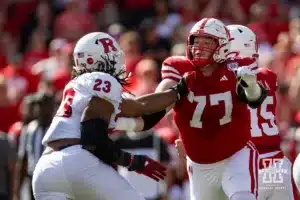 Nebraska Cornhusker offensive lineman Gunnar Gottula (77) blocks Rutgers Scarlet Knight defensive lineman Wesley Bailey (23) during a college football game Saturday, October 5, 2024, in Lincoln, Nebraska. Photo by John S. Peterson.